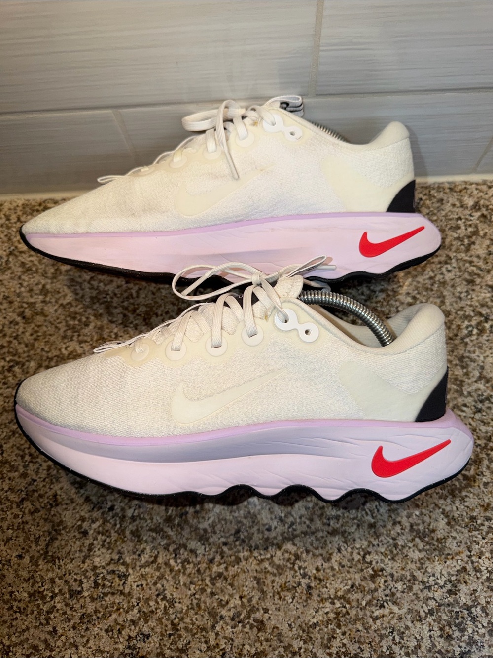 Nike Women’s White & Pink Running Shoes with Red Swoosh